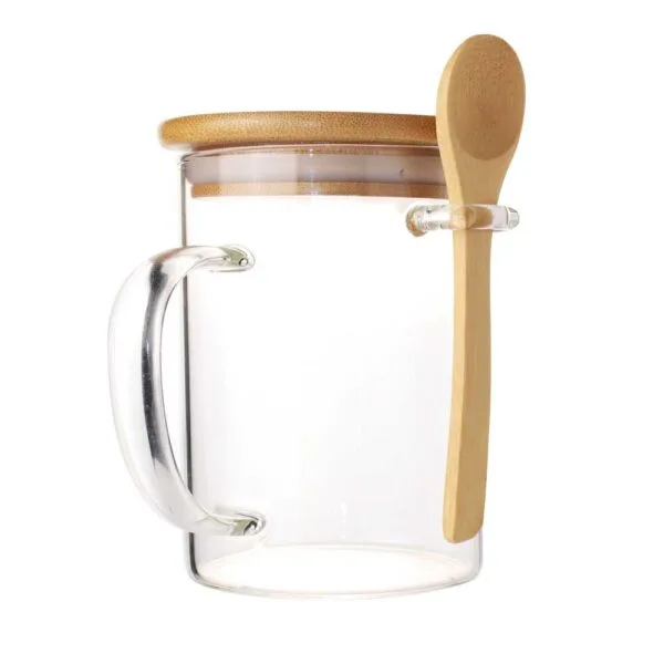 Glass mug with bamboo lid and spoon